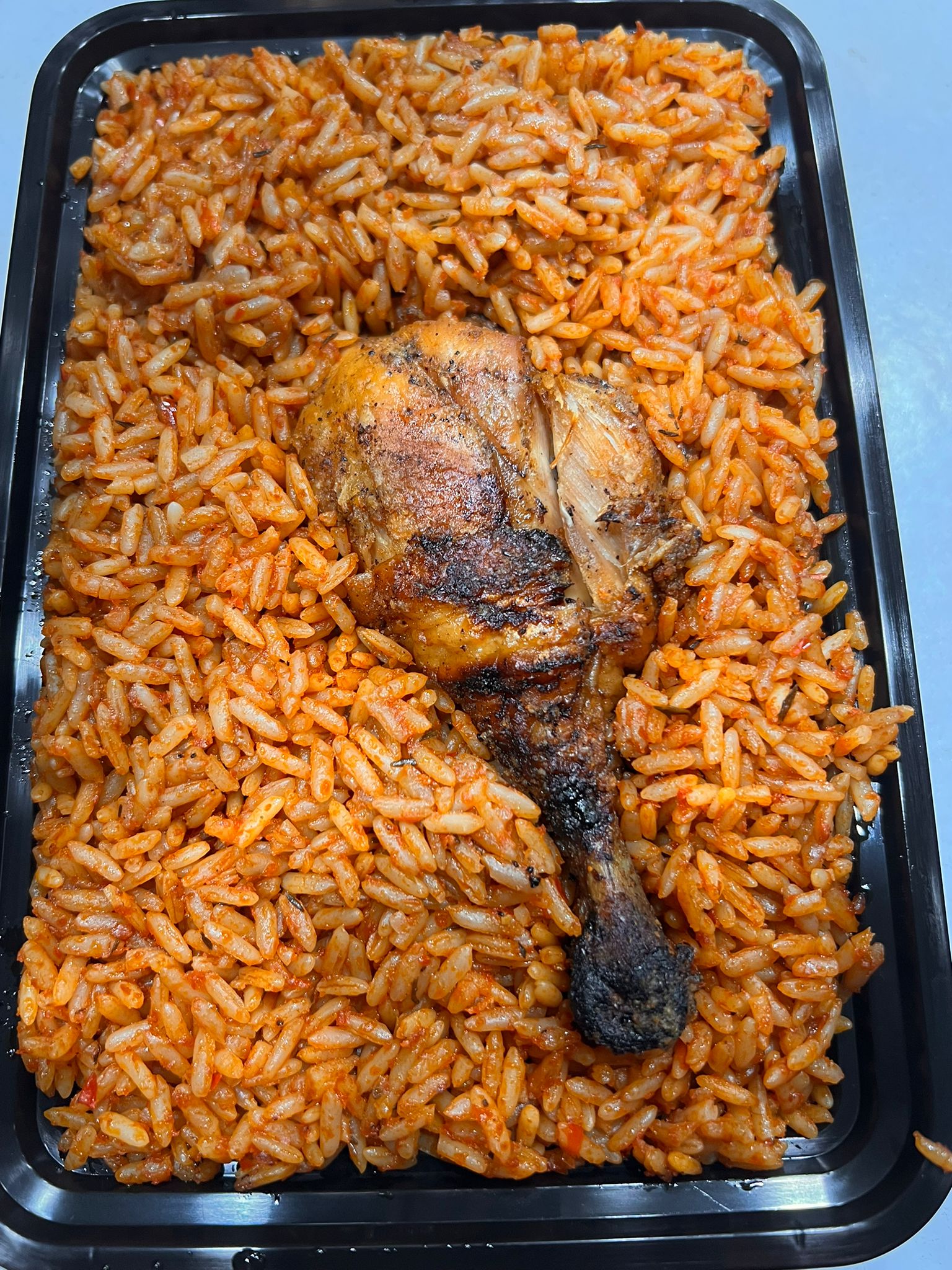 Jollof Rice and Drumstick or Wing